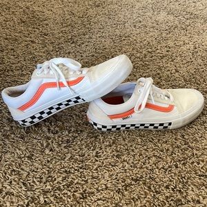 Orange and black checkered Vans